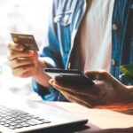 Men use their credit cards through mobile internet banking apps to shop online and digital payment ideas.