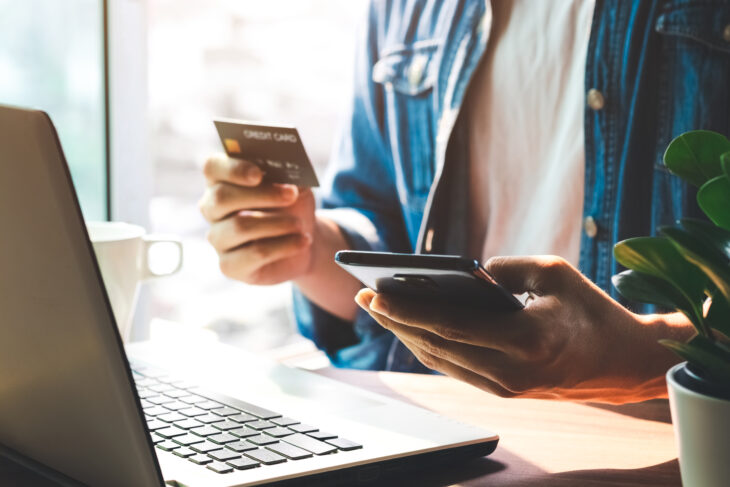 Men use their credit cards through mobile internet banking apps to shop online and digital payment ideas.