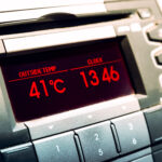 Summer hot temperatures. High temperature on car dashboard display.